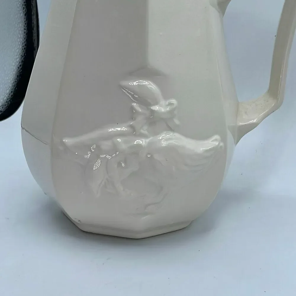 Vintage embossed ceramic country goose pitcher .